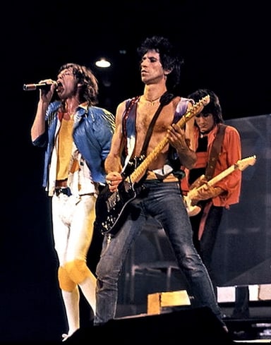 Which Rolling Stones album released on Rolling Stones Records has a cover featuring a working zipper?
