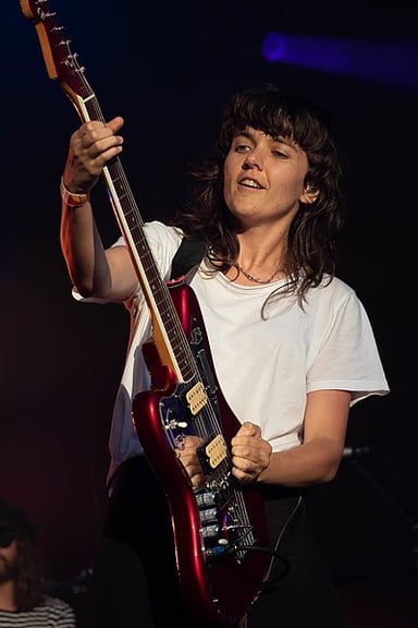 Which instrument does Courtney Barnett famously play left-handed?