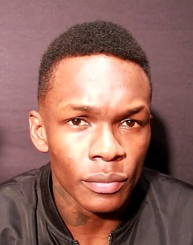 In which martial art did Israel Adesanya compete as a former Glory Middleweight Championship title challenger?