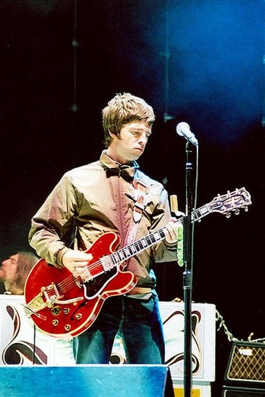 What genre of music does Noel Gallagher mainly write?