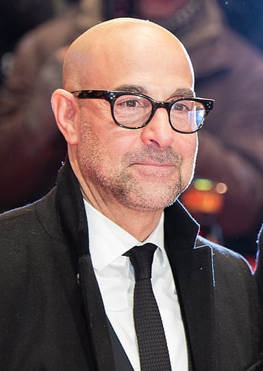 Tucci's role in'Burlesque' can best be described as?