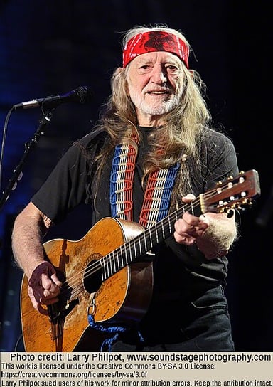 What was the name of the high school band Willie Nelson joined as their lead singer and guitar player?