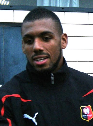 Does Yann M'Vila have a brother who also plays football?