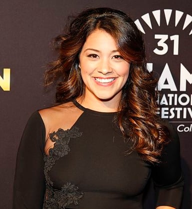 What is the first prominent TV role of Gina Rodriguez?