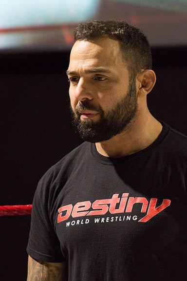 With which wrestling organization is Santino Marella currently signed?