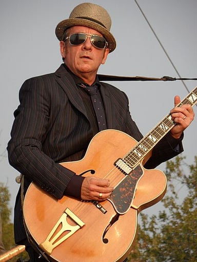 In which year was Costello inducted into the Songwriters Hall of Fame?