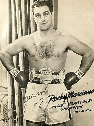 Against which boxer did Marciano have a close fight in 1950?