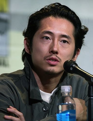 In which ongoing animated series does Steven Yeun voice the character Mark Grayson?