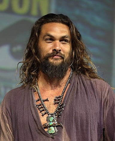 In which movie does Momoa's character wield a trident?