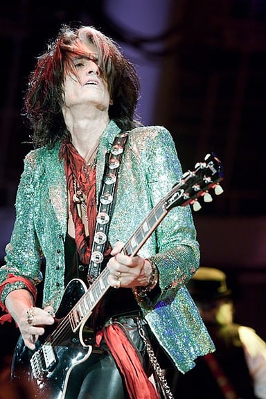 Which of Joe Perry's guitars is known for its unique green finish?