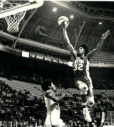 In what year was Julius Erving named one of the 40 most important athletes of all time by Sports Illustrated?