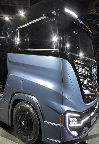 In which month and year did Nikola Corporation deliver its first two battery-electric trucks?