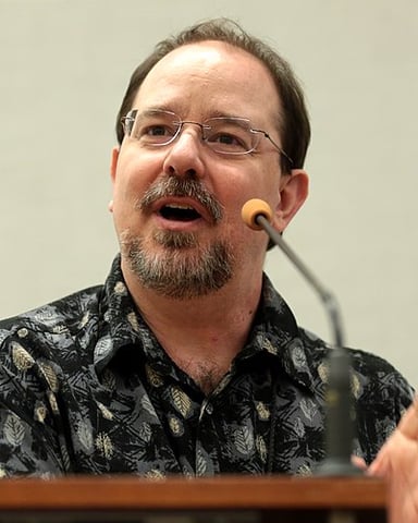 What genre does John Scalzi primarily write in?