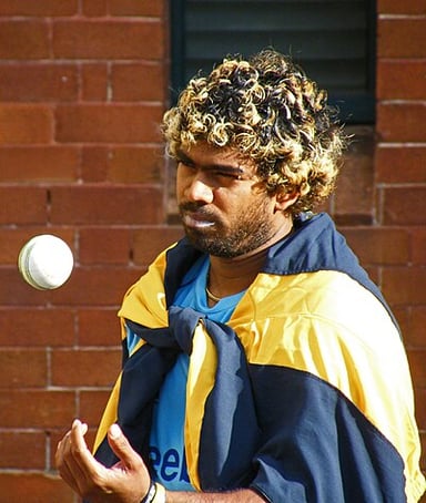 Malinga became the first bowler to 100 wickets in T20Is in which year?