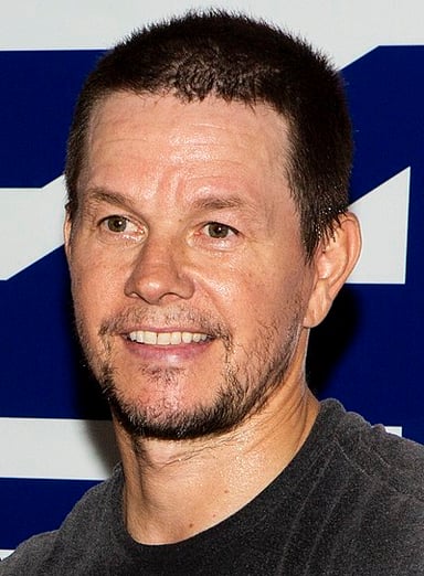 Which film marked Mark Wahlberg's debut in big-budget action movies?