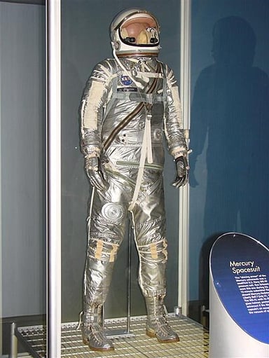 Which project selected Gus Grissom to be one of the first Americans in outer space?