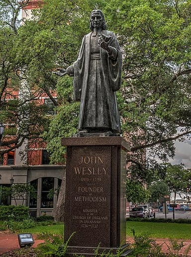 What was John Wesley’s church denomination?