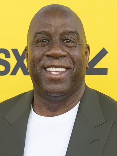 In which year did Magic Johnson first retire from professional basketball?