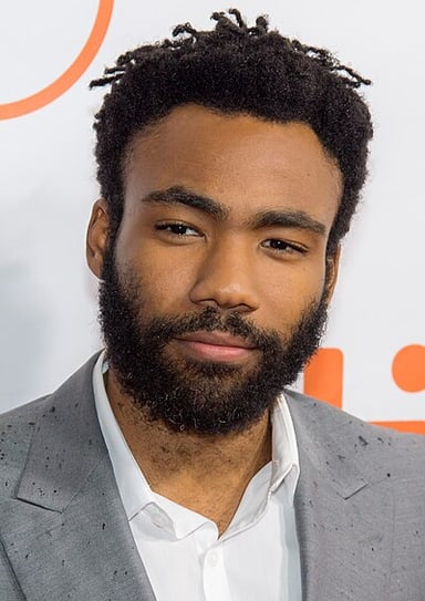 Who hired Donald Glover as a writer for the NBC sitcom 30 Rock?