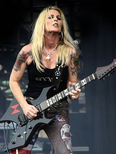 What genre did Lita Ford follow in her solo career?