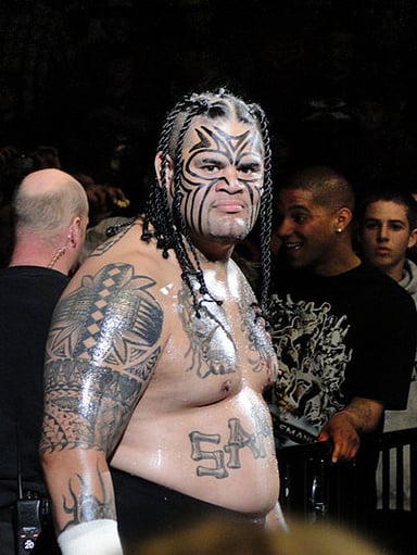 Which famous wrestler is Umaga's cousin?