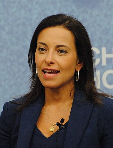 Where did Dina Powell's family settle when they came to the United States?