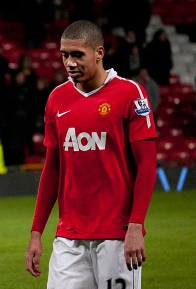 Before going professional, which type of club did Smalling play for?