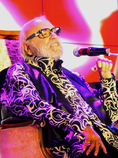 Which progressive rock band was Roussos a member of?