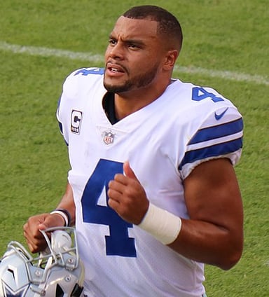 How many division titles has Dak Prescott led the Cowboys to?