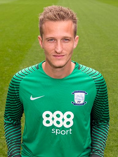 Against which team did Lindegaard make his senior debut for Denmark?