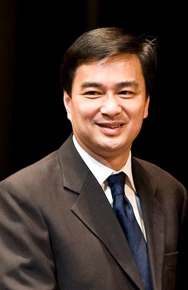 Which college did Abhisit Vejjajiva attend?