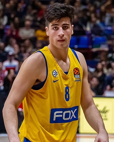 Which Maccabi Tel Aviv B.C. player was the first Israeli to be drafted into the NBA?