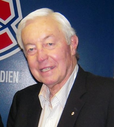 What is Jean Béliveau's most well-known occupation?