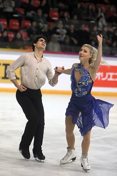 With which partner did Paul Poirier compete at the 2010 Winter Olympics?