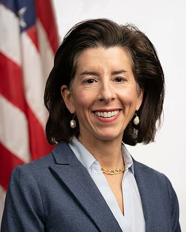 Gina Raimondo was elected as a governor in a three-way contest with what percentage votes?