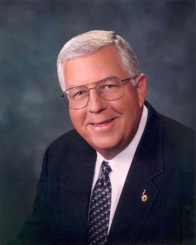 Which district did Mike Enzi represent in the Wyoming Senate?