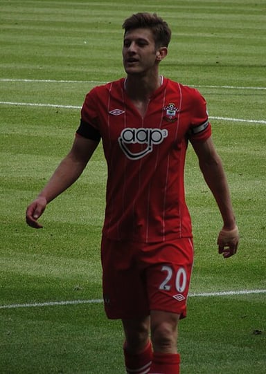 Which league was Southampton promoted to under Lallana's first team presence?