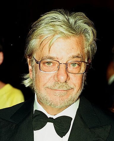 When did Giancarlo Giannini start his stage career, appearing in a production of Romeo and Juliet?