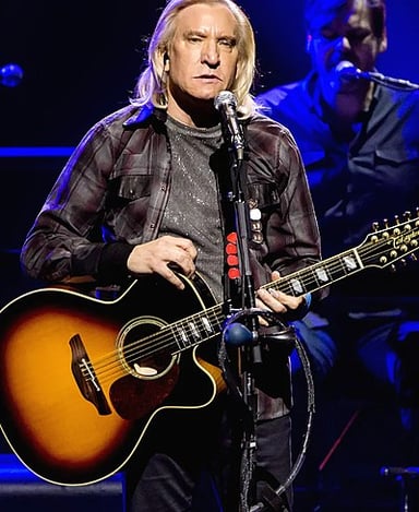 Which band did Joe Walsh join that included a famous drummer from The Beatles?
