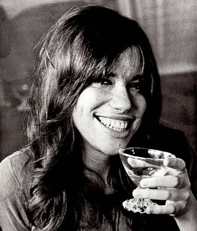 In what year was Carly Simon inducted into the Songwriters Hall of Fame?