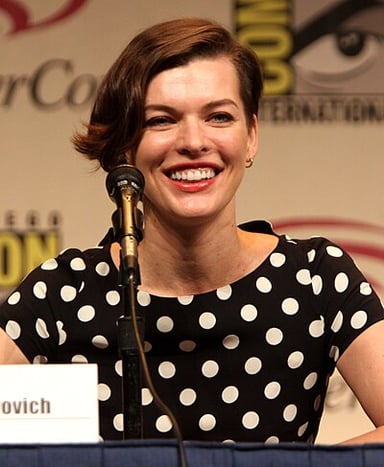 What is the name of Milla Jovovich's official website where she releases demos for other songs?