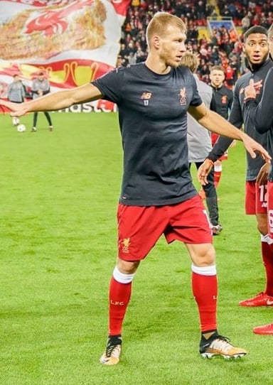 At which club did Klavan first earn the captaincy for his national team?