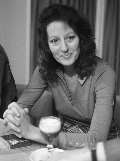 At which university in England did Germaine Greer hold an academic position?