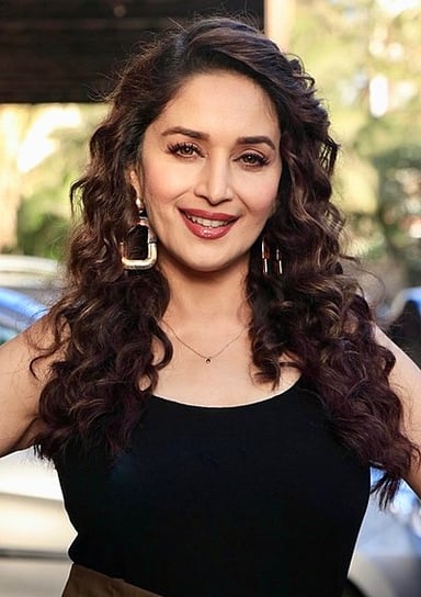 For which film did Madhuri Dixit win her first Filmfare Award for Best Actress?