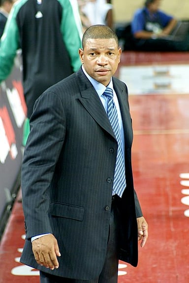 Which team did Doc Rivers begin his NBA coaching career with?