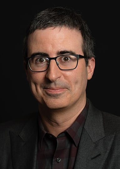 In which animated film did John Oliver voice Vanity Smurf?