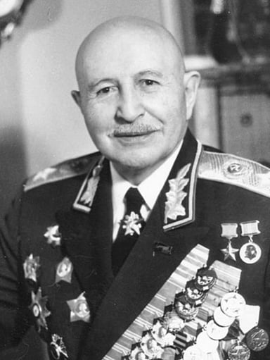 Who was the first non-Slavic military officer to become a Front commander in WW2 before Bagramyan?