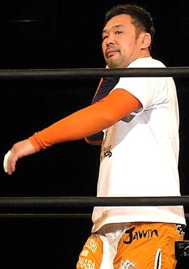 Who was Sakuraba's tag team partner in GHC Tag Team Champions?