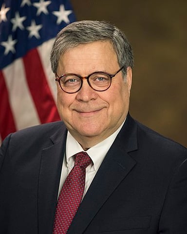 What theory does William Barr support regarding presidential authority over the executive branch?