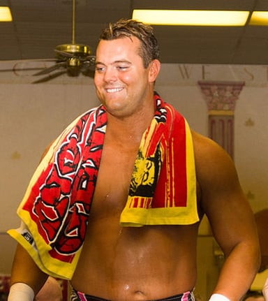 Under what name did Davey Boy Smith Jr have his first tenure in WWE?